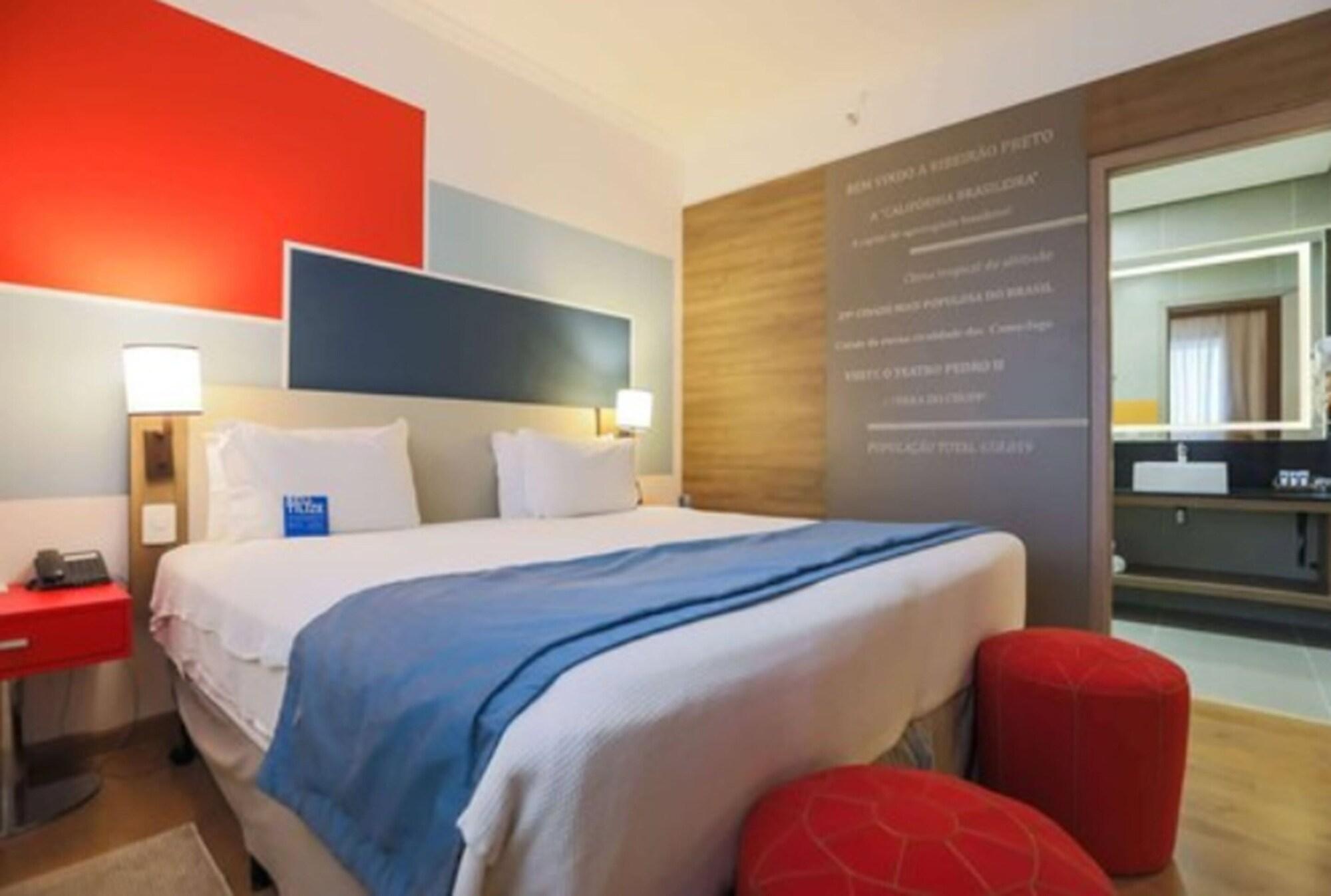 TRYP By Wyndham Ribeirão Preto Hotel Exterior foto A room at the hotel